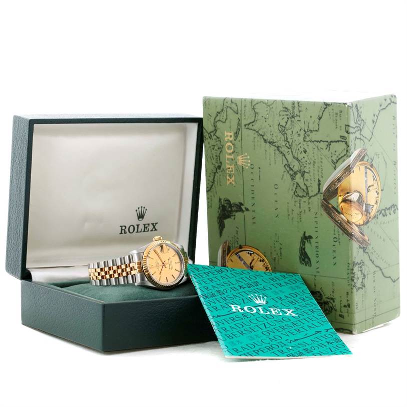 The image shows a Rolex Mid-Size 68273 Women's Steel and Gold (two tone) Champagne Dial 68273 Women's Steel and Gold (two tone) Champagne Dial model watch in its box, along with the packaging and instruction manual.