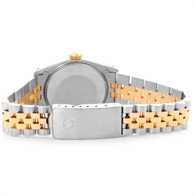 The image shows the back case and clasp of a Rolex Mid-Size 68273 Women's Steel and Gold (two tone) Champagne Dial 68273 Women's Steel and Gold (two tone) Champagne Dial watch, featuring a two-tone metal bracelet.