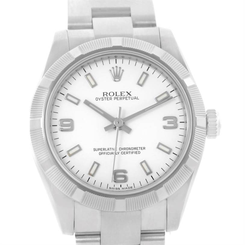 The image shows a front view of a Rolex Oyster Perpetual Mid-Size watch, highlighting the dial, bezel, and part of the bracelet.