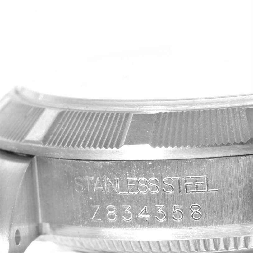 Close-up of a Rolex Mid-Size 177210 Women's Stainless Steel White Dial 177210 Women's Stainless Steel White Dial watch's stainless steel case, showing the serial number engraving.