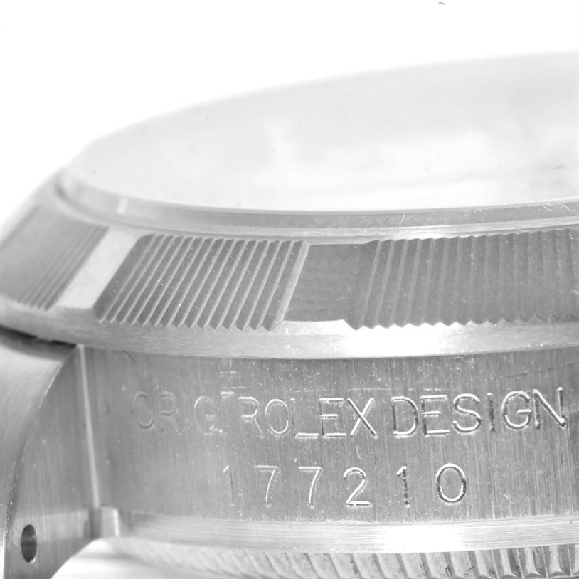 This image shows a close-up of the side of a Rolex Mid-Size 177210 Women's Stainless Steel White Dial 177210 Women's Stainless Steel White Dial watch model, highlighting the bezel and the stamped serial number.