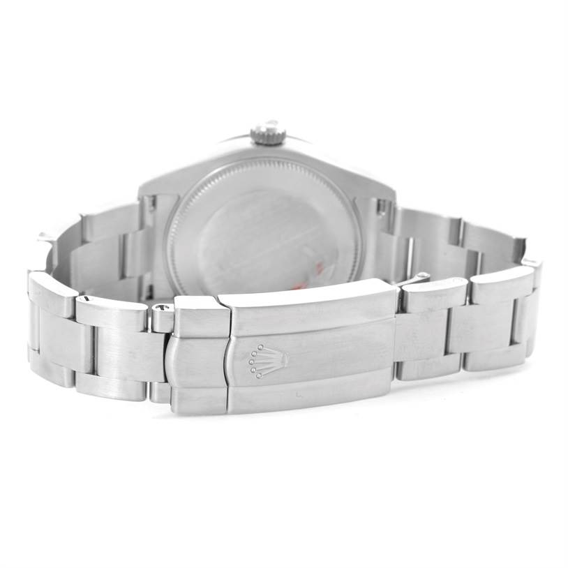 The image shows the back and stainless steel bracelet clasp of the Mid-Size Rolex watch.