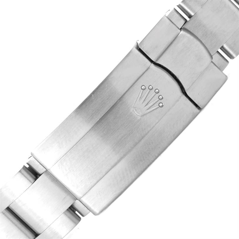 The image shows a close-up of a clasp from a Rolex Mid-Size 177210 Women's Stainless Steel White Dial 177210 Women's Stainless Steel White Dial watch band.