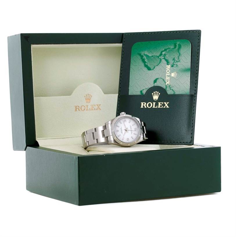 The Rolex Mid-Size 177210 Women's Stainless Steel White Dial 177210 Women's Stainless Steel White Dial model watch is displayed in its open box alongside its green authentication card holder.