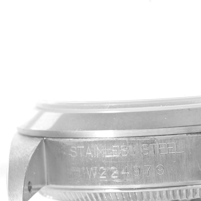 This image shows a close-up of the side case and bezel engraving on a Rolex Mid-Size 68240 Women
s Stainless Steel Blue Dial 68240 Women
s Stainless Steel Blue Dial model watch.