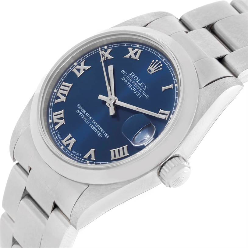 This Rolex Mid-Size 68240 Women
s Stainless Steel Blue Dial 68240 Women
s Stainless Steel Blue Dial Datejust watch is shown at an angle highlighting the dial, bezel, crown, and part of the bracelet.