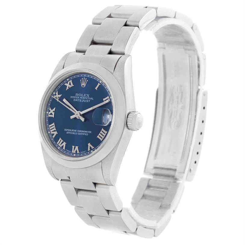 The Rolex Mid-Size 68240 Women
s Stainless Steel Blue Dial 68240 Women
s Stainless Steel Blue Dial watch is shown at a three-quarter angle, highlighting its blue dial, bracelet, crown, and partially open clasp.