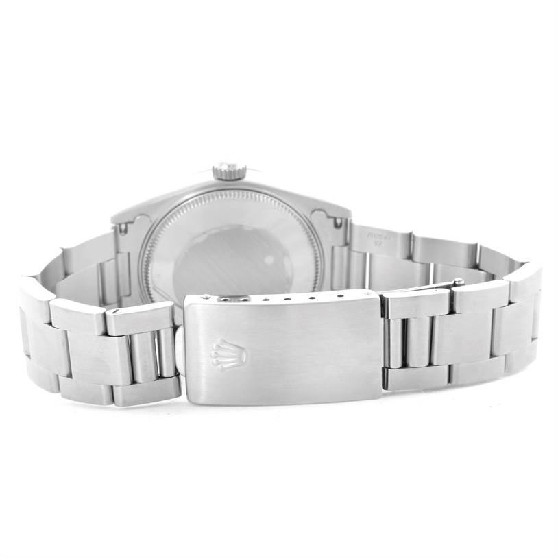 The image shows the backside and clasp of a Mid-Size Rolex watch.