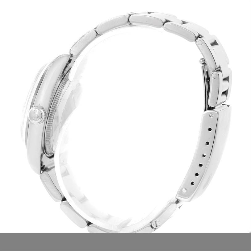 The image shows a side profile of a Rolex Mid-Size 68240 Women
s Stainless Steel Blue Dial 68240 Women
s Stainless Steel Blue Dial watch, highlighting the crown, case, and bracelet.