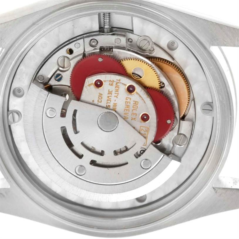 This image shows the internal mechanism of a Rolex Mid-Size 68240 Women
s Stainless Steel Blue Dial 68240 Women
s Stainless Steel Blue Dial watch, highlighting various gears and the movement components.