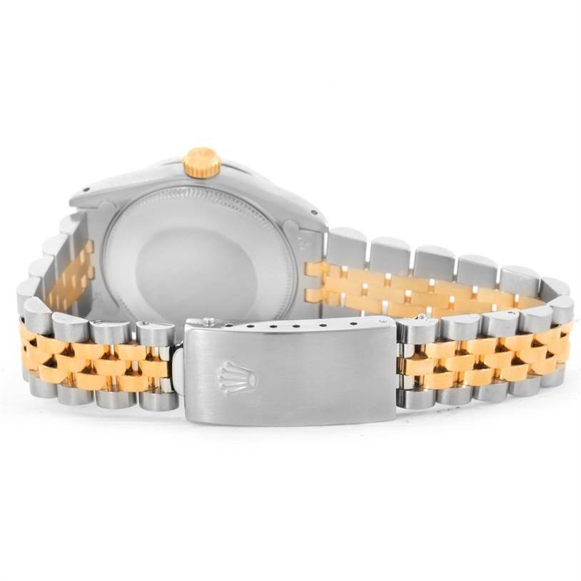 This image shows the back of a Rolex Mid-Size 68273 Women's Steel and Gold (two tone) Silver Dial 68273 Women's Steel and Gold (two tone) Silver Dial watch, highlighting its clasp and two-tone bracelet.