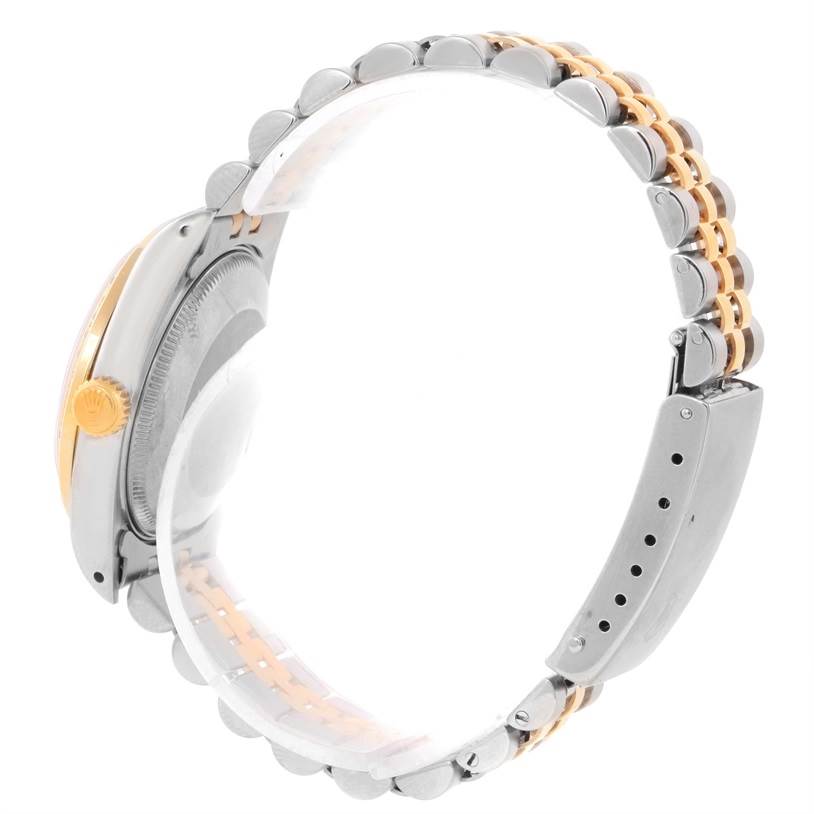 The image shows a side view of a Rolex Mid-Size 68273 Women's Steel and Gold (two tone) Silver Dial 68273 Women's Steel and Gold (two tone) Silver Dial model watch, highlighting the band and the crown.