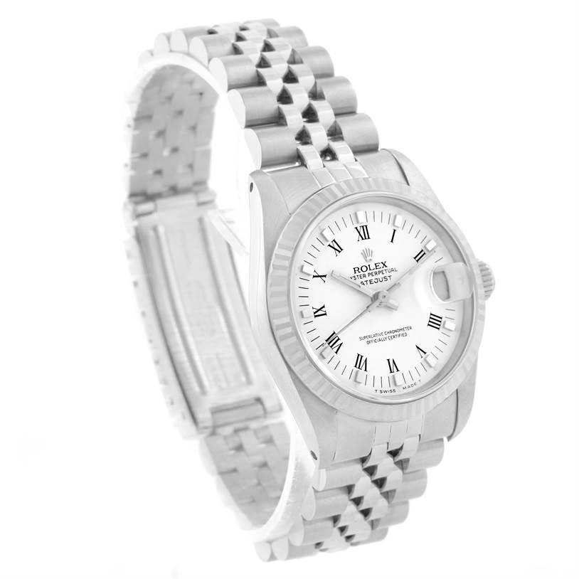 The image shows a Rolex Mid-Size 68274 Women's Stainless Steel White Dial 68274 Women's Stainless Steel White Dial Datejust watch at a tilted angle, focusing on the dial, bezel, and bracelet.