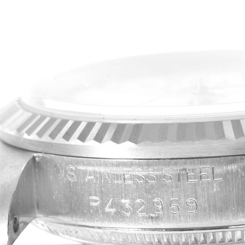 The image shows a side view of the Rolex Mid-Size 68274 Women's Stainless Steel White Dial 68274 Women's Stainless Steel White Dial model, specifically focusing on the bezel and part of the case with engraving.