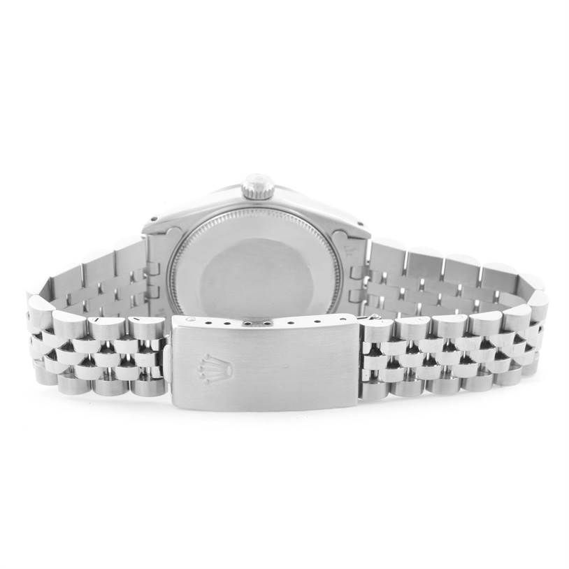 This image shows the back side and clasp of a Rolex Mid-Size 68274 Women's Stainless Steel White Dial 68274 Women's Stainless Steel White Dial watch with a metal bracelet.