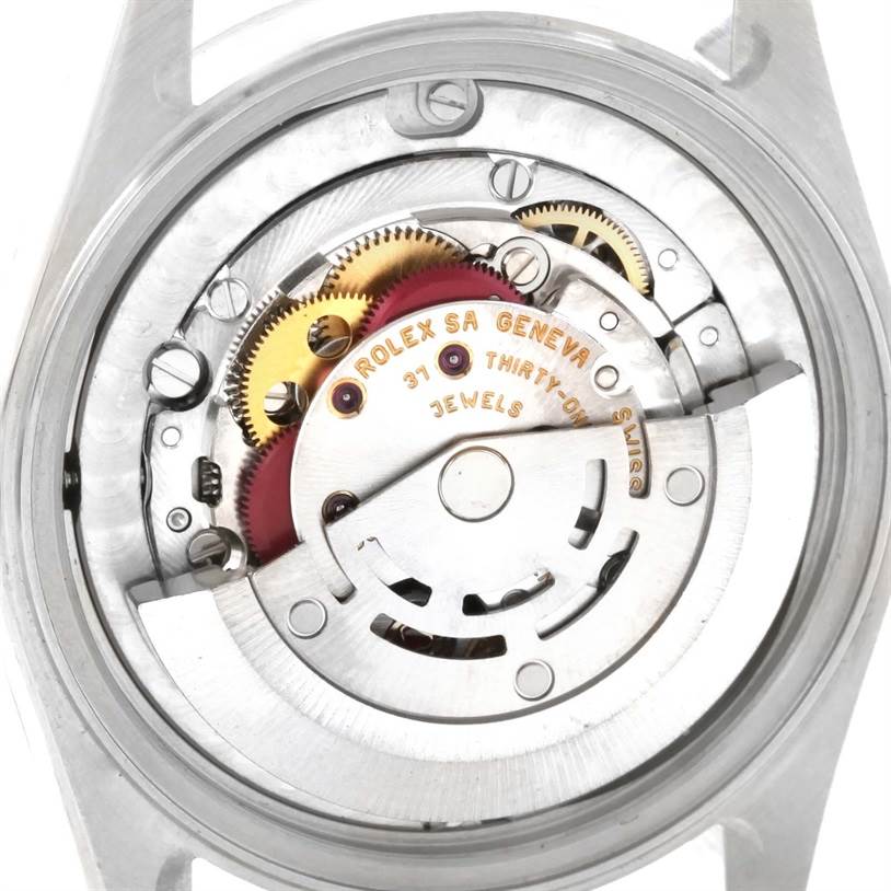 The image shows the movement parts of a Rolex Mid-Size 78240 Women's Stainless Steel Pink Dial 78240 Women's Stainless Steel Pink Dial model watch from the back angle.
