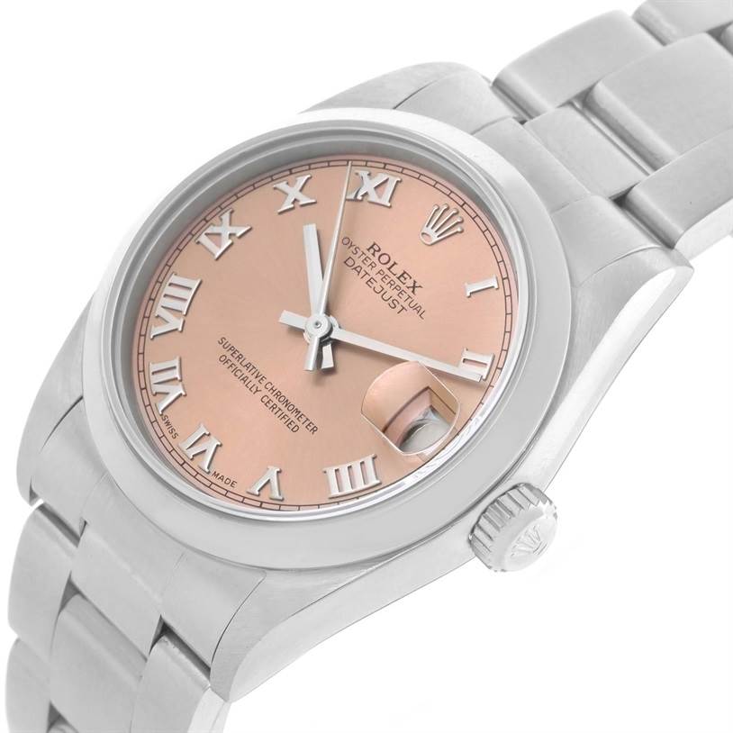 This Rolex Mid-Size 78240 Women's Stainless Steel Pink Dial 78240 Women's Stainless Steel Pink Dial Datejust watch is shown at a tilted angle, featuring a pink dial with Roman numerals and a date magnifier.