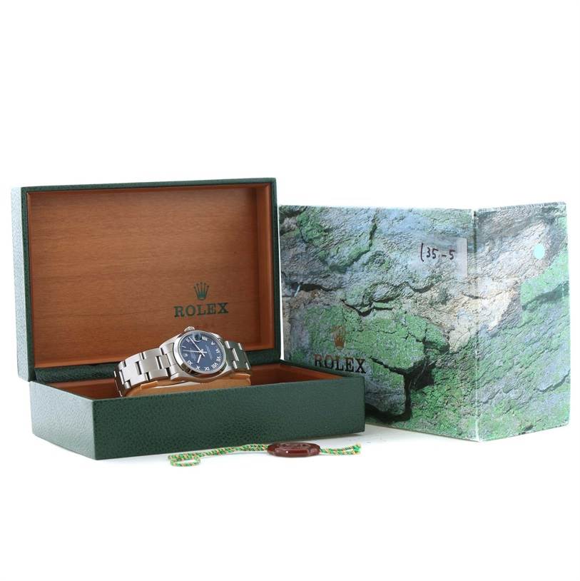 The image shows a Rolex Mid-Size 78240 Women's Stainless Steel Blue Dial 78240 Women's Stainless Steel Blue Dial model watch in an open green box, with its outer packaging and hang tags visible.