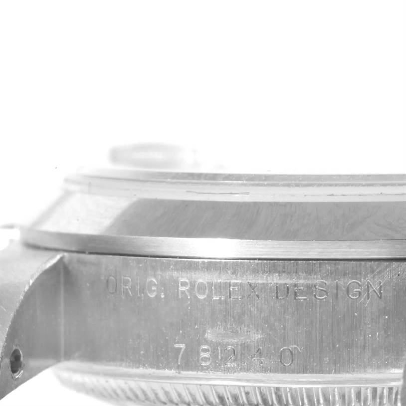 The image shows a close-up side view of the casing and bezel of a Rolex Mid-Size 78240 Women's Stainless Steel Blue Dial 78240 Women's Stainless Steel Blue Dial model, featuring the engraved design and reference number.