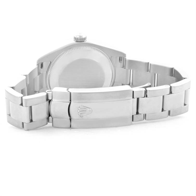 This image shows the back of the Mid-Size Rolex watch, focusing on the closed clasp and bracelet links.