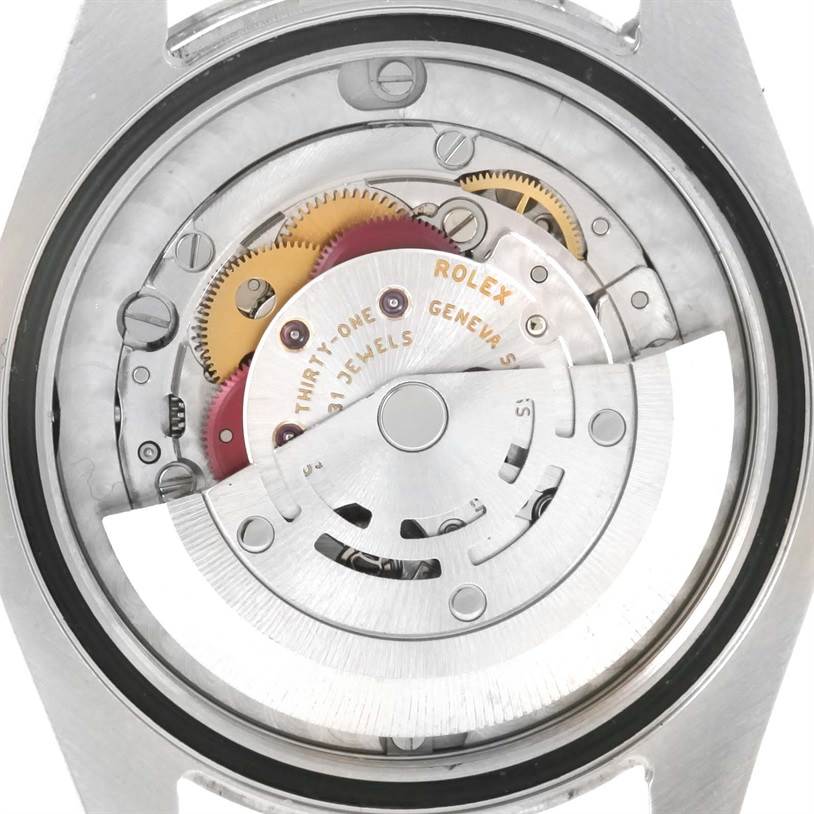 This image shows the rear view of a Rolex Mid-Size 178240 Women's Stainless Steel White Dial 178240 Women's Stainless Steel White Dial watch, highlighting its intricate internal mechanical movement.