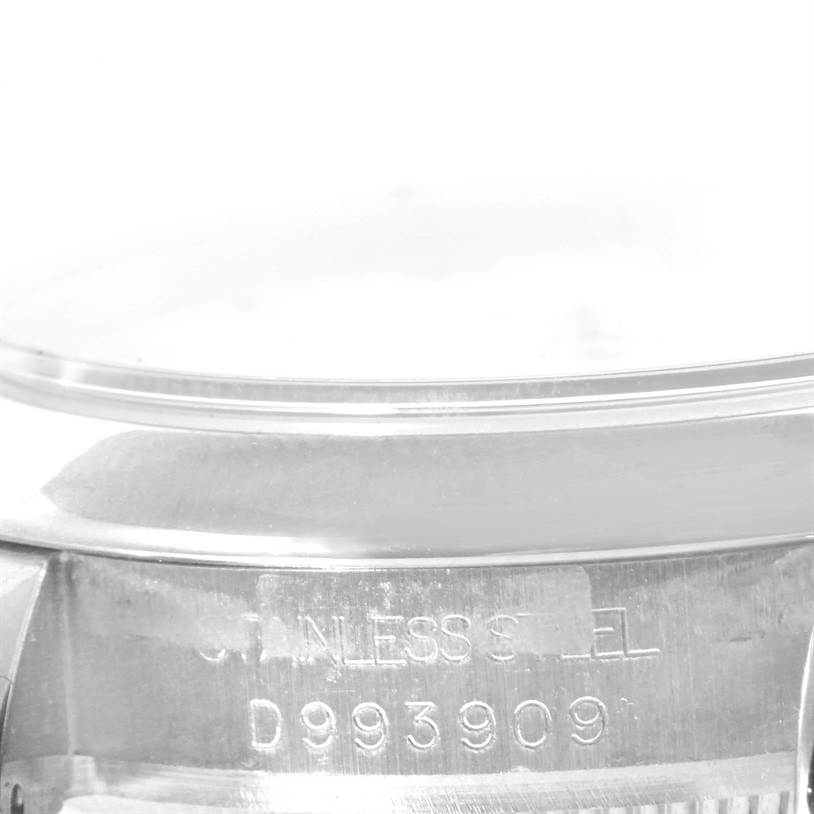 The image shows a close-up view of the side of a Rolex Mid-Size 178240 Women's Stainless Steel White Dial 178240 Women's Stainless Steel White Dial model watch, displaying the serial number and "STAINLESS STEEL" engraving.