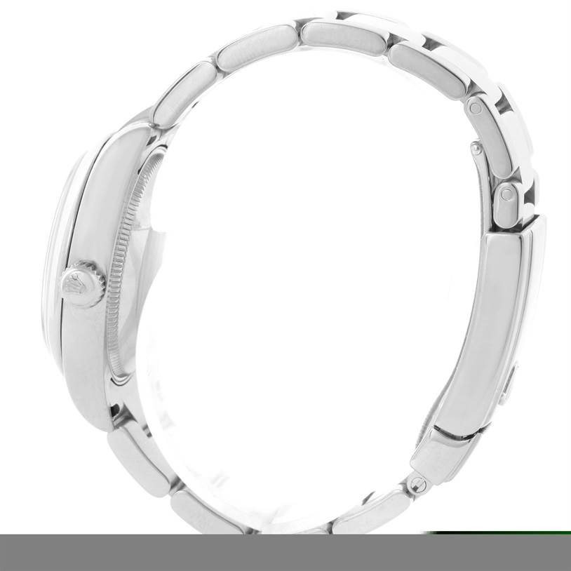 A side profile of a Mid-Size Rolex watch, showcasing the crown, case, and part of the bracelet.