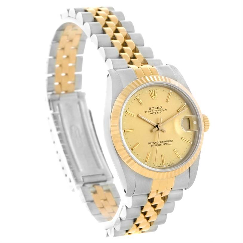 This Rolex Mid-Size 68273 Women's Steel and Gold (two tone) Champagne Dial 68273 Women's Steel and Gold (two tone) Champagne Dial model is shown at a three-quarter angle, highlighting the gold and silver bracelet, bezel, and dial.