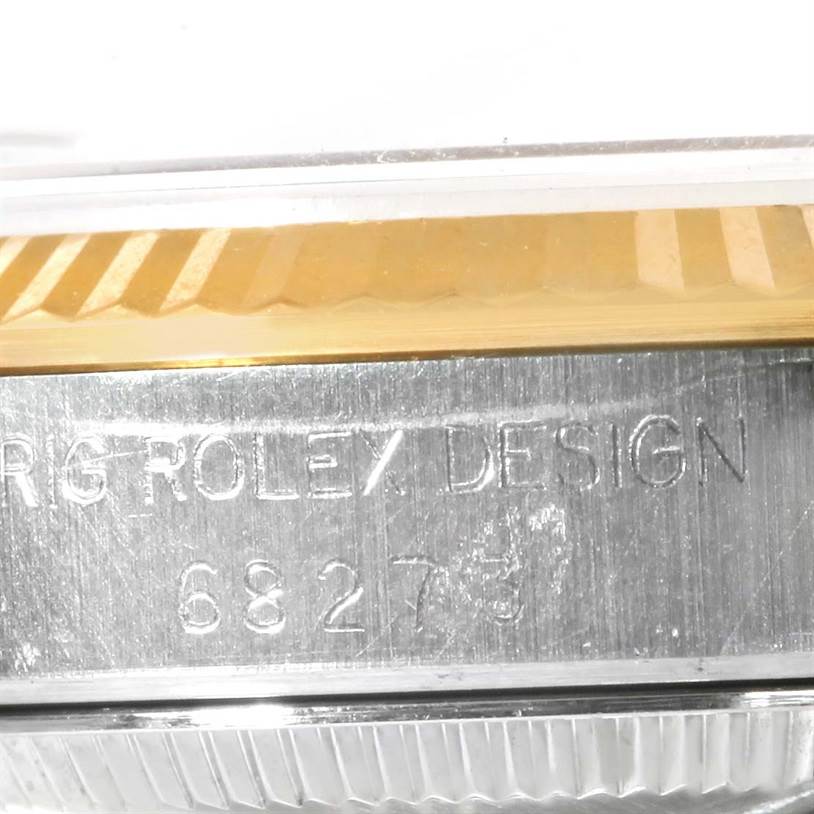 The image shows the side angle of a Mid-Size Rolex watch, highlighting the model number 68273 and "ORIG ROLEX DESIGN" engraving.