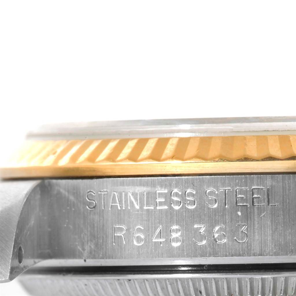 This image shows a close-up angle of a Rolex Mid-Size 68273 Women's Steel and Gold (two tone) Champagne Dial 68273 Women's Steel and Gold (two tone) Champagne Dial watch focusing on the stainless steel case and fluted bezel.