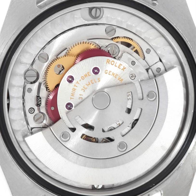 The image shows the internal mechanism of a Rolex Mid-Size 178240BLSO Women's Stainless Steel Blue Dial 178240BLSO Women's Stainless Steel Blue Dial model watch, including gears and the rotor, from a back angle.