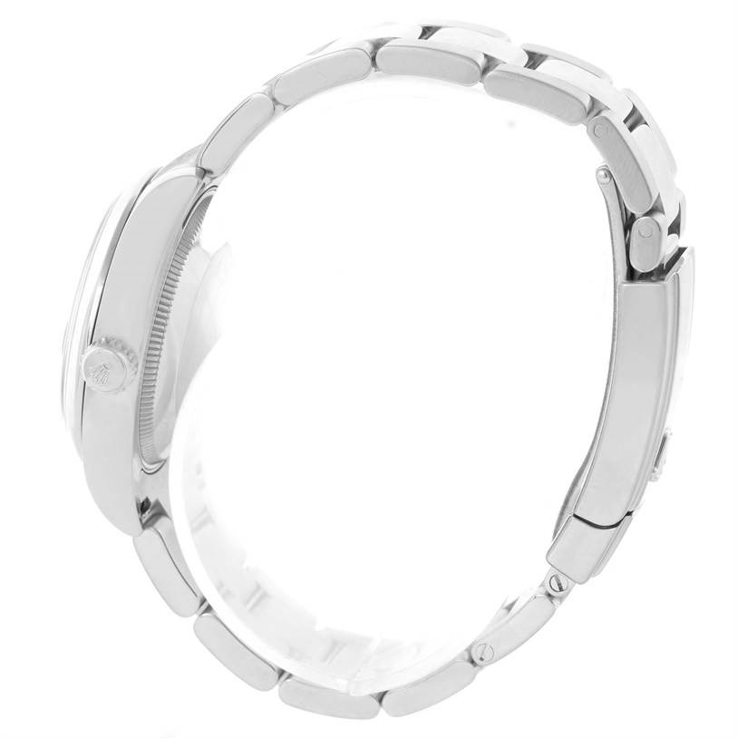 This side view of the Mid-Size Rolex watch shows the case, crown, and bracelet.