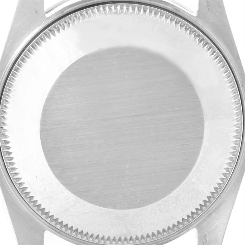 The image shows a detailed top-down view of the case back and bezel of a Mid-Size Rolex watch.