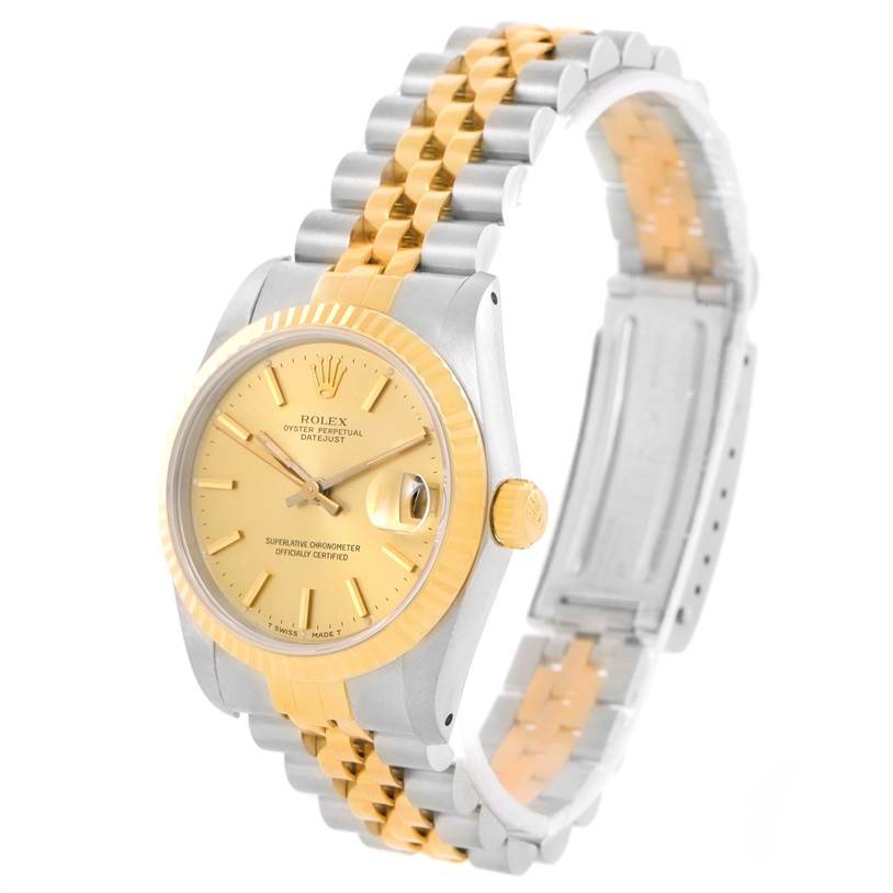 This image shows a Rolex Mid-Size 68273 Women's Steel and Gold (two tone) Champagne Dial 68273 Women's Steel and Gold (two tone) Champagne Dial Datejust watch at an angle displaying the face, crown, and two-tone bracelet.