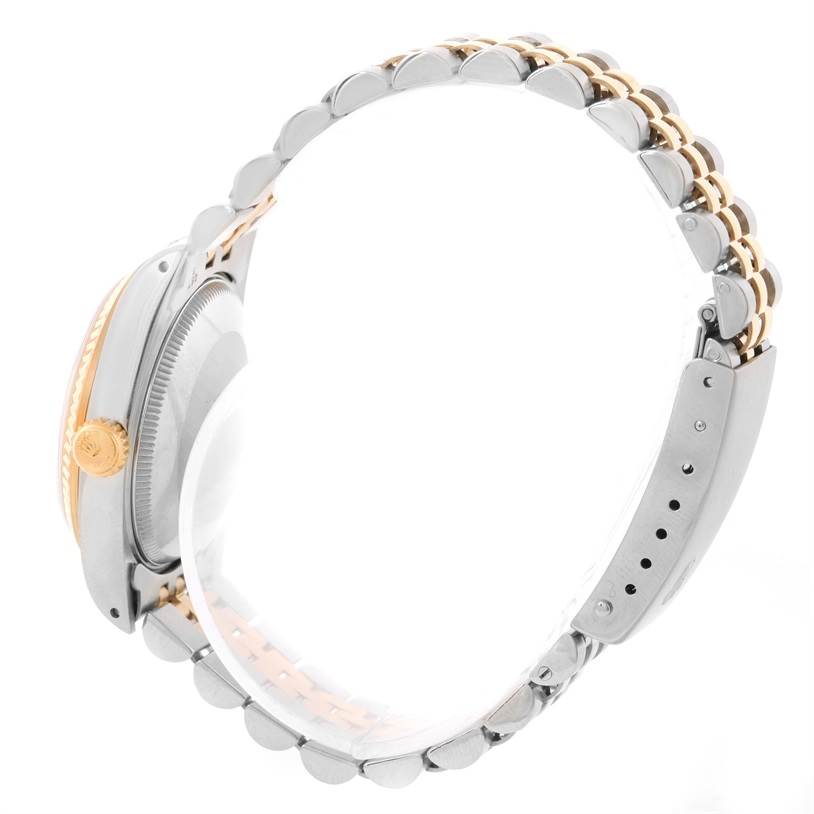 This image shows a side view of the Rolex Mid-Size 68273 Women's Steel and Gold (two tone) Champagne Dial 68273 Women's Steel and Gold (two tone) Champagne Dial model, highlighting the bracelet and crown.