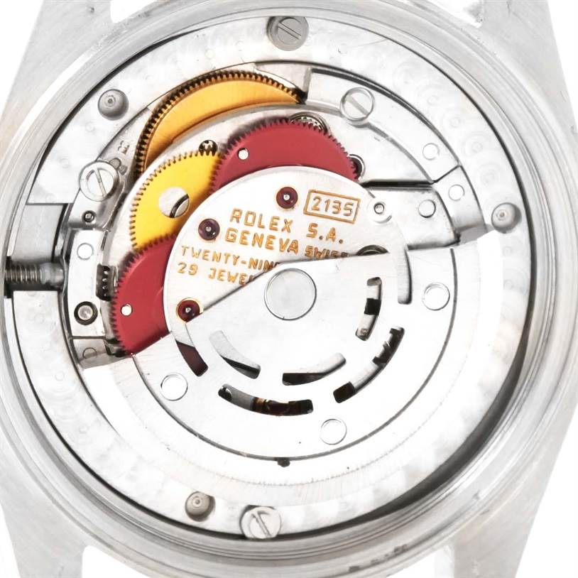 The image shows the detailed internal mechanics of a Mid-Size Rolex watch viewed from the back.