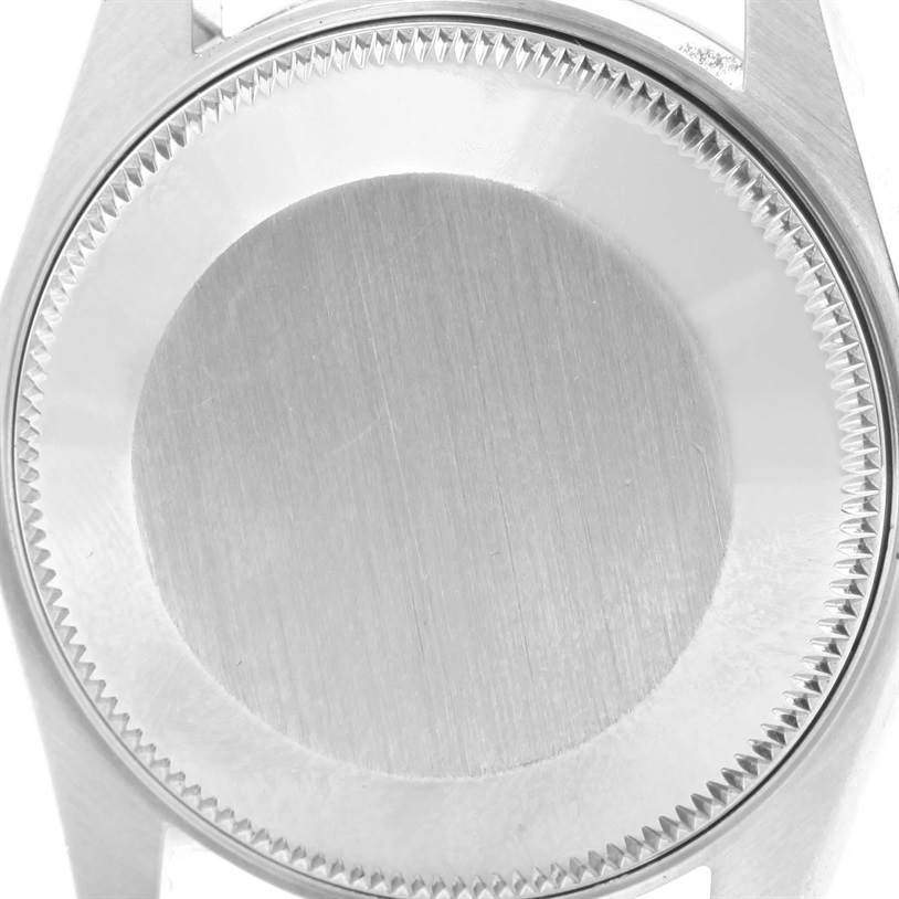 The image shows a close-up of the back case of a Mid-Size Rolex watch.