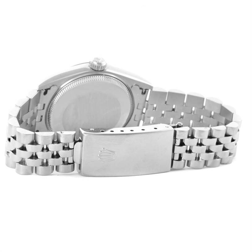 The image shows the back case, crown, and bracelet of a Rolex Mid-Size 77014 Women's Stainless Steel Blue Dial 77014 Women's Stainless Steel Blue Dial model watch.