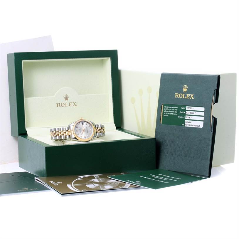 The image shows a Rolex Mid-Size 178273 Women's Steel and Gold (two tone) Silver Dial 178273 Women's Steel and Gold (two tone) Silver Dial model watch inside its open box, with accompanying booklets and certification.