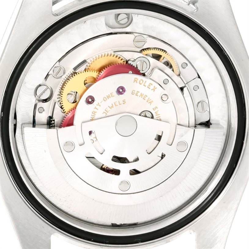 This Rolex Mid-Size 178240SRJ Women's Stainless Steel Grey Dial 178240SRJ Women's Stainless Steel Grey Dial watch image shows the inner mechanical parts from the rear with gears and the rotor visible.