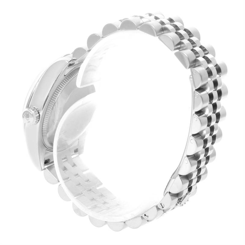 The image shows the side and bracelet of a mid-size Rolex watch, highlighting the crown and bezel.