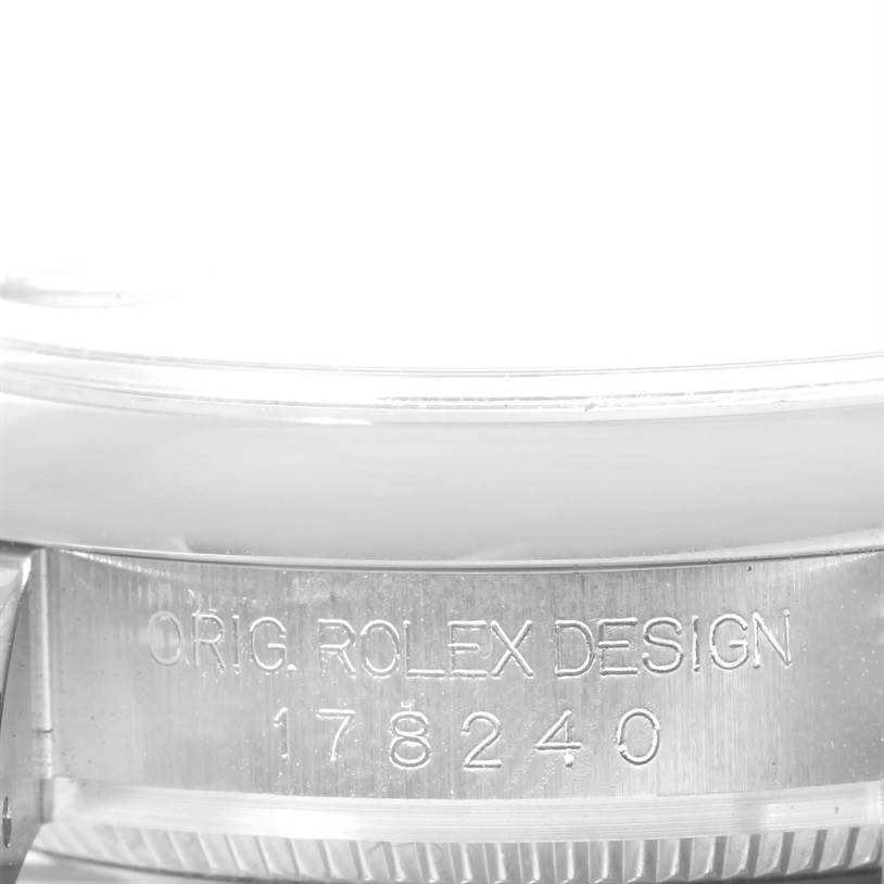 This close-up angle shows the side of the Rolex Mid-Size 178240SRJ Women's Stainless Steel Grey Dial 178240SRJ Women's Stainless Steel Grey Dial model watch, specifically the case with "ORIG. ROLEX DESIGN 178240" engraving.