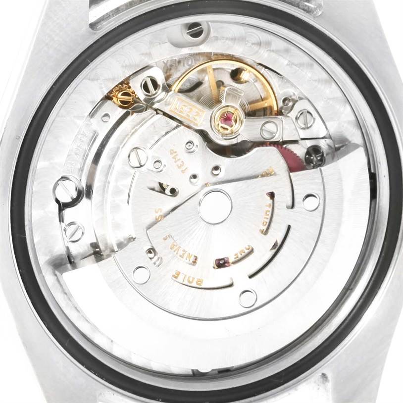 This image shows the internal mechanical movement of a mid-size Rolex watch from a rear view.