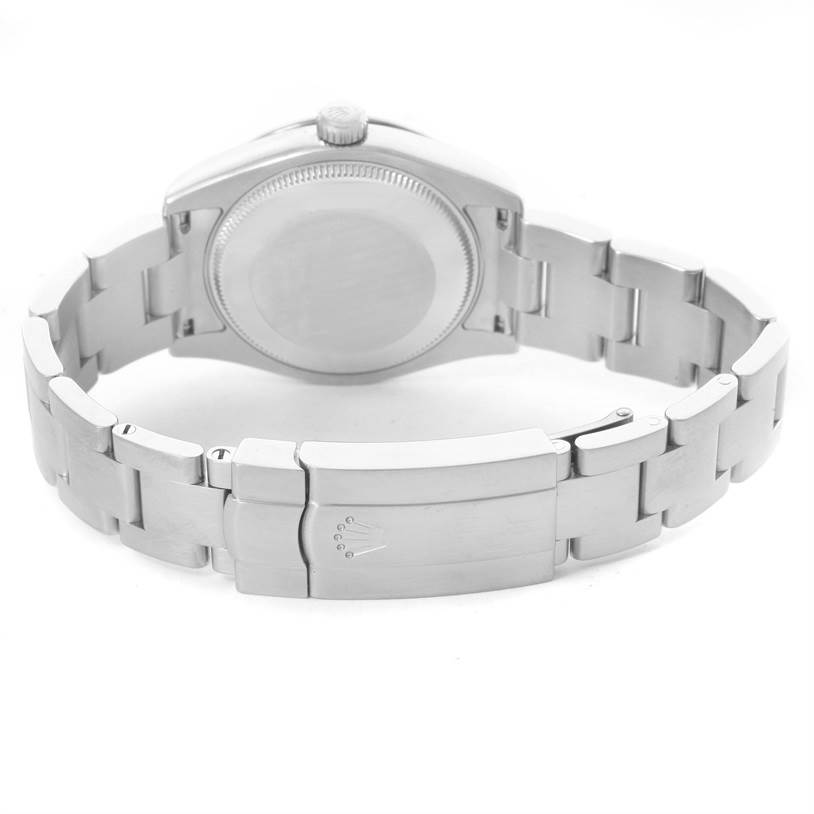 This image shows the back case and bracelet clasp of a Mid-Size Rolex watch from a rear angle.