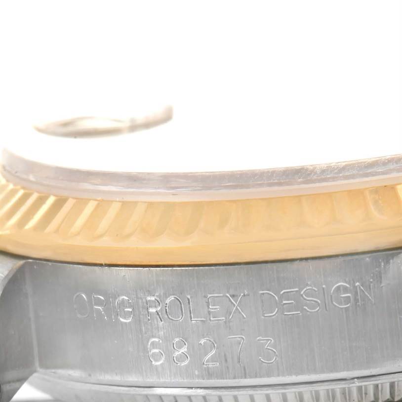 The image shows a close-up side view of the Rolex Mid-Size 68273 Women's Steel and Gold (two tone) Champagne Dial 68273 Women's Steel and Gold (two tone) Champagne Dial model watch case, highlighting the bezel and model number 68273 engraving.