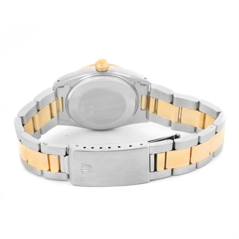 The image shows the back view of a Rolex Mid-Size 68273 Women's Steel and Gold (two tone) Champagne Dial 68273 Women's Steel and Gold (two tone) Champagne Dial watch, highlighting the two-tone metal bracelet and closed clasp.