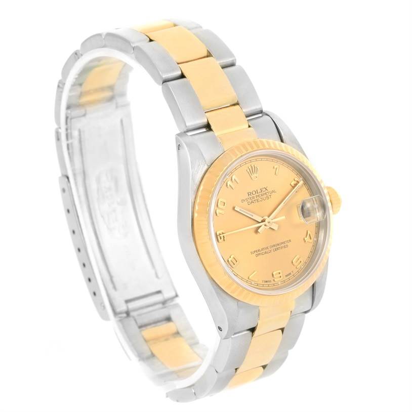 This Rolex Mid-Size 68273 Women's Steel and Gold (two tone) Champagne Dial 68273 Women's Steel and Gold (two tone) Champagne Dial Datejust watch is shown at a three-quarter angle, highlighting the dial, band, and case.