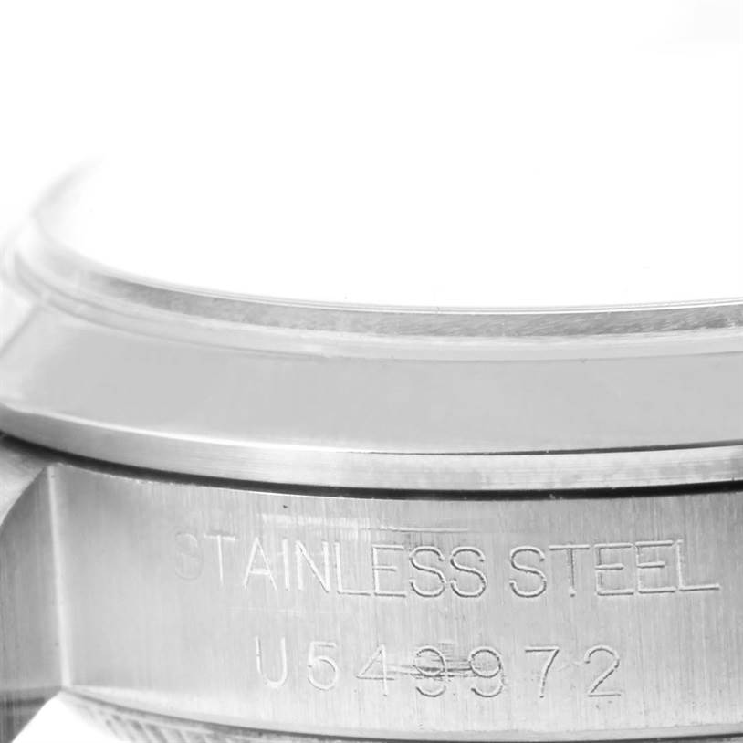 This image shows a close-up of the side and bezel of a Rolex Mid-Size 68240 Women's Stainless Steel Blue Dial 68240 Women's Stainless Steel Blue Dial watch, highlighting the stainless steel material and model number.