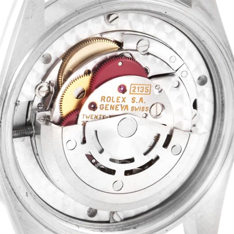 The image shows the internal movement mechanism of a Mid-Size Rolex watch, viewed from the back.