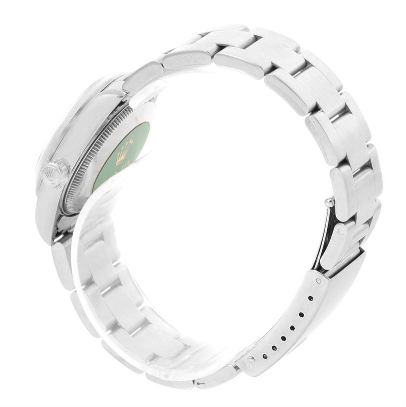 The image shows a side view of a Mid-Size Rolex watch, highlighting the band, case, and part of the clasp.